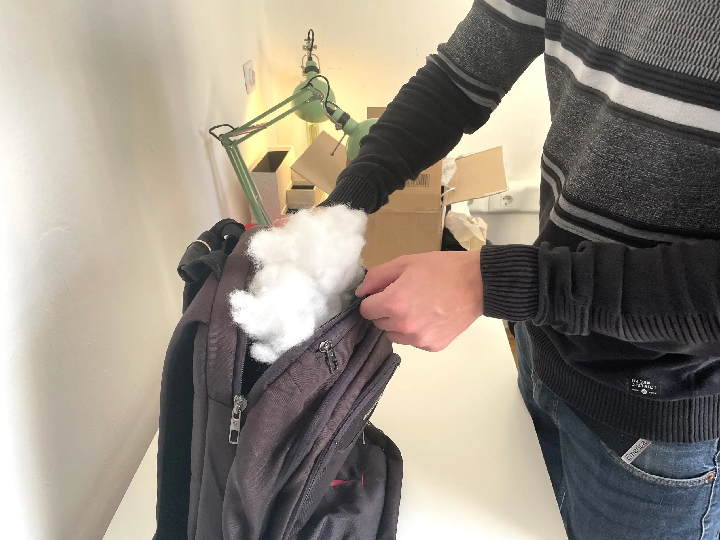 a backpack being stuffed
