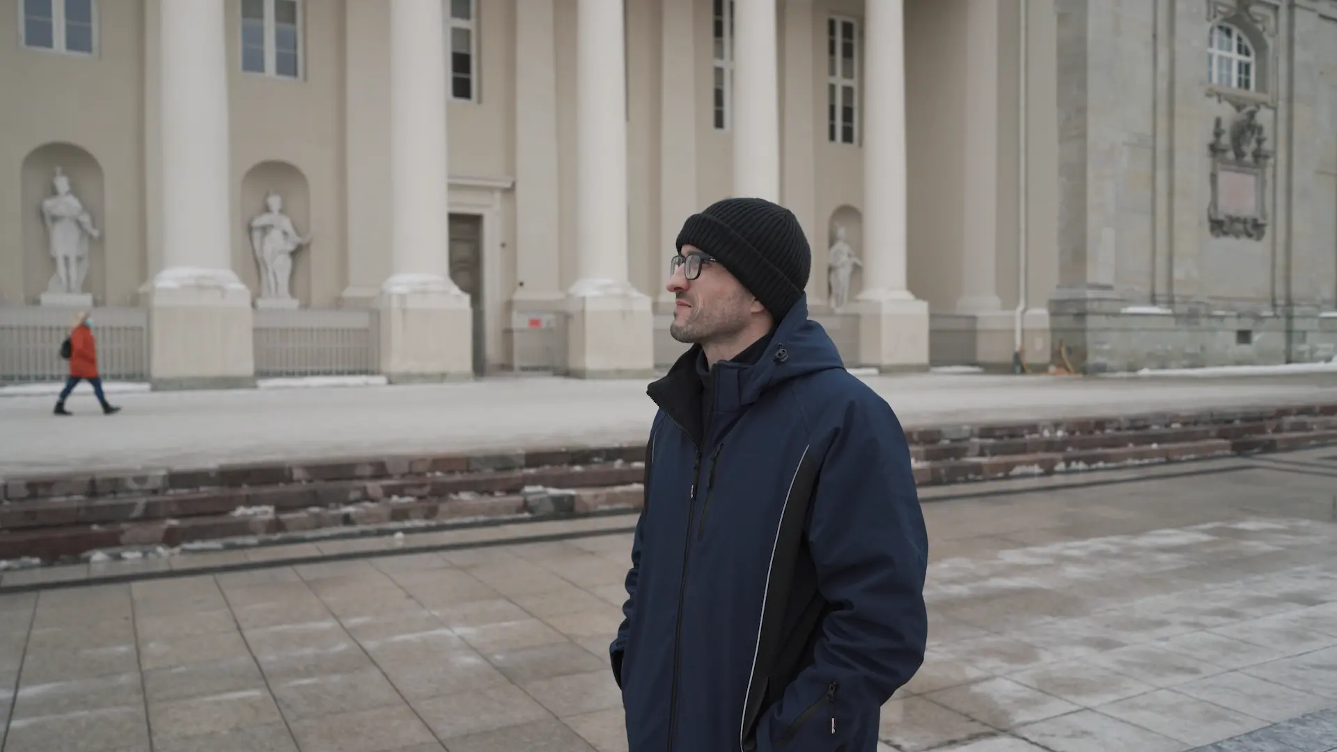 Sergei stands in front of palace