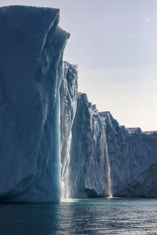 Meltwater pours off the side of glacier 
